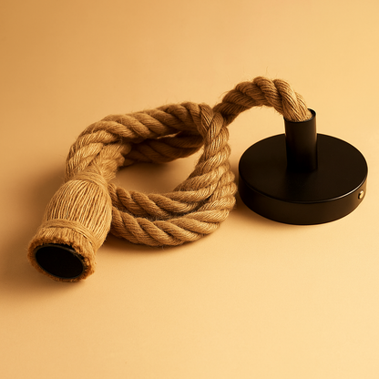 Handwoven hemp rope pendant light in natural tone, ideal for adding boho charm and warmth to dining rooms or cozy corners.