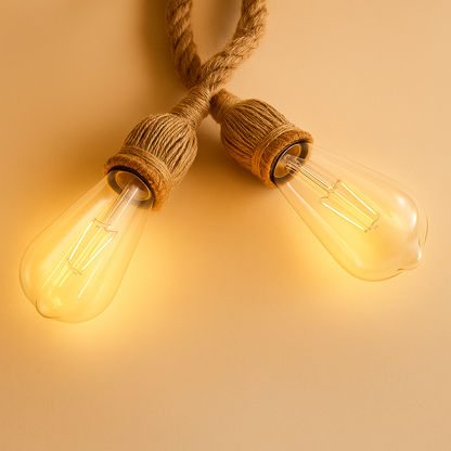 Handwoven hemp rope pendant light in natural tone, ideal for adding boho charm and warmth to dining rooms or cozy corners.