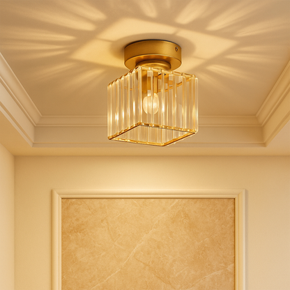 Modern crystal ceiling light with brass finish, ideal for creating a warm and elegant ambiance in bedrooms or hallways.