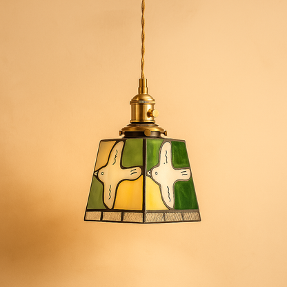 Handmade Tiffany glass pendant light with copper accents, ideal for adding warmth and elegance to living rooms or bedrooms.