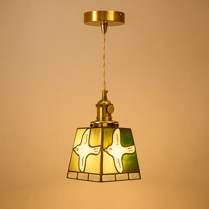 Handmade Tiffany glass pendant light with copper accents, ideal for adding warmth and elegance to living rooms or bedrooms.