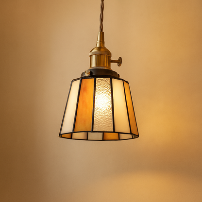 Handmade Tiffany glass pendant light with copper accents, ideal for adding warmth and elegance to living rooms or bedrooms.