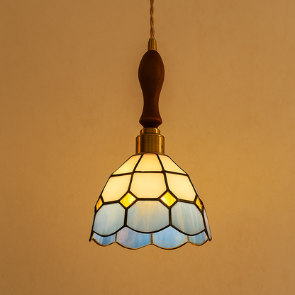 Handmade Tiffany glass pendant light with copper accents, ideal for adding warmth and elegance to living rooms or bedrooms.