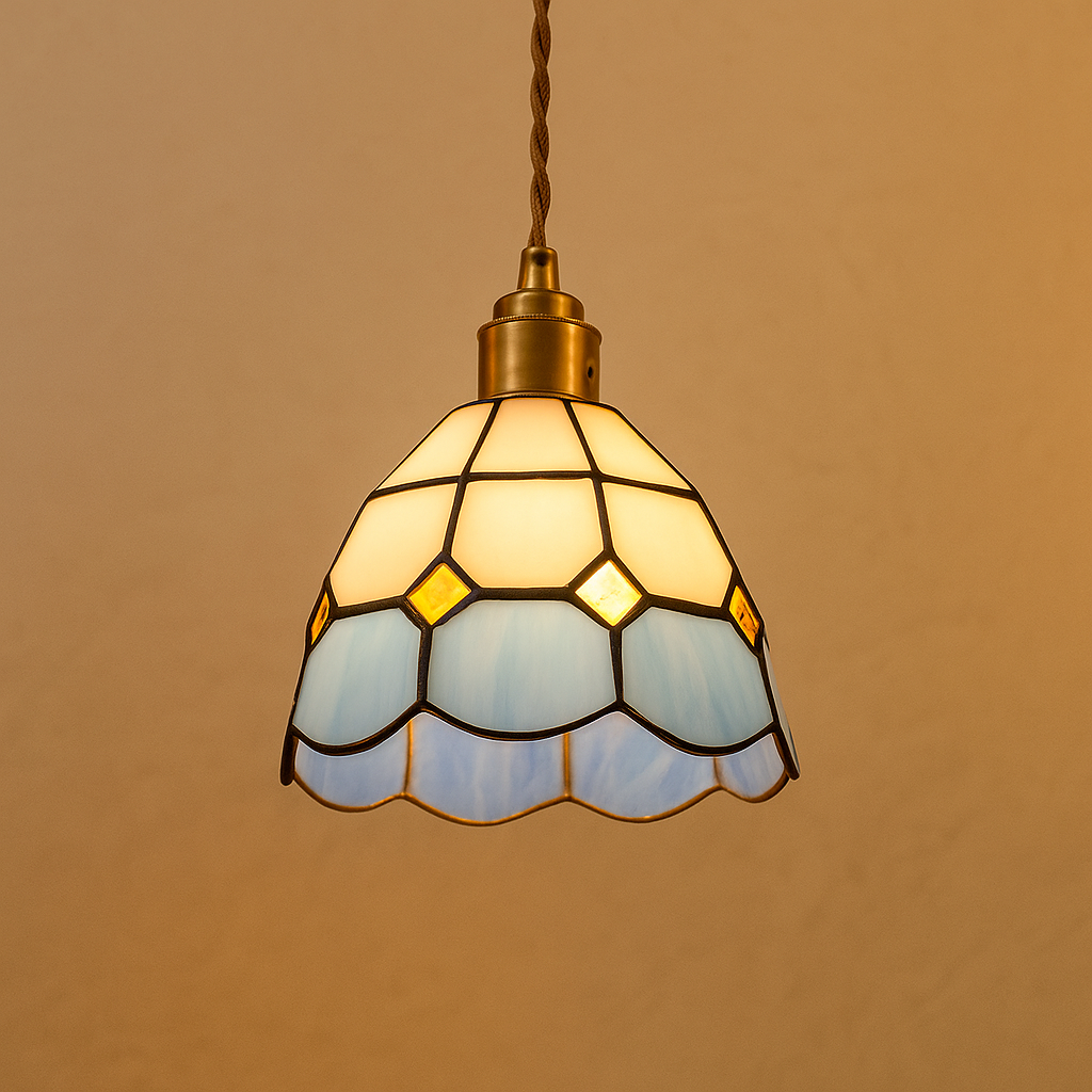 Handmade Tiffany glass pendant light with copper accents, ideal for adding warmth and elegance to living rooms or bedrooms.