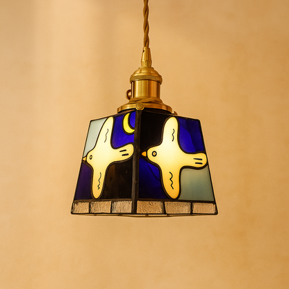 Handmade Tiffany glass pendant light with copper accents, ideal for adding warmth and elegance to living rooms or bedrooms.
